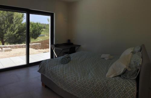 A bed or beds in a room at Villa las Colinas Golf Resort