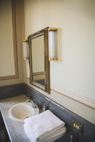 a bathroom with a sink and a mirror at Castello Di Mornico Losana in Mornico Losana