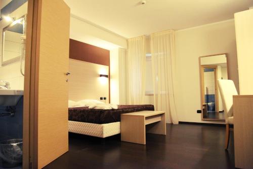 Ліжко або ліжка в номері Hotel Sogni D'Oro Airport