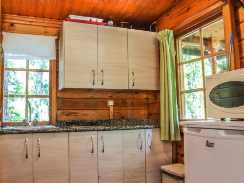 Kuchyň nebo kuchyňský kout v ubytování Cabañas de Madera Sanabria