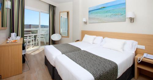 Un ou plusieurs lits dans un hébergement de l'établissement Hotel Samos