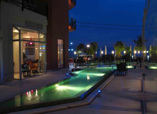 a swimming pool in the middle of a building at night at Thalassa in Loutra Edipsou