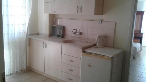 Η κουζίνα ή μικρή κουζίνα στο İpek Apart Otel