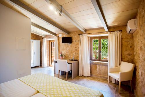 Postel nebo postele na pokoji v ubytování Agroturismo Sa Marina