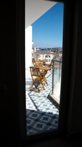a view from a window of a balcony with chairs at Topcity Hostel & Suites in Lagos