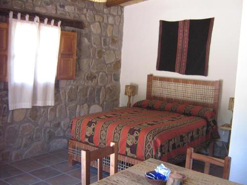 Hosteria La Morada tesisinde bir odada yatak veya yataklar