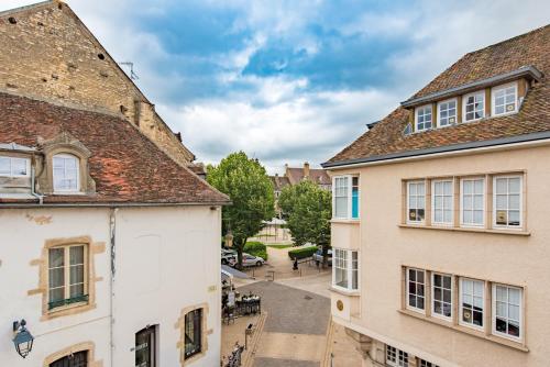 an alley between two buildings in the medieval town at Le Central Boutique Hôtel in Beaune
