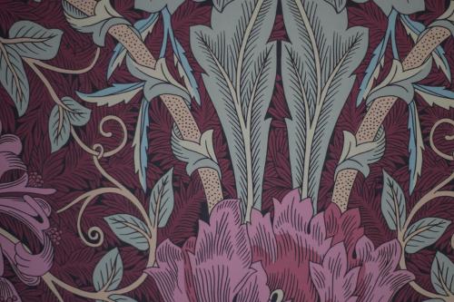 a pattern of flowers and plants on a purple background at Pennygate Lodge in Craignure