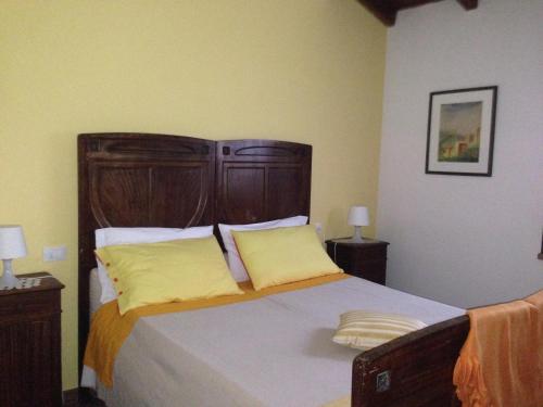 Un pat sau paturi într-o cameră la Agriturismo Olianina