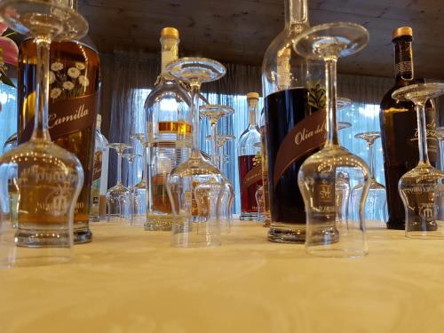 a group of wine glasses sitting on a table at Style Hotel Grifone in Madonna di Campiglio