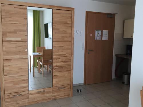 a sliding glass door in a room with a table at Boardinghouse Casita Amann in Friedrichshafen