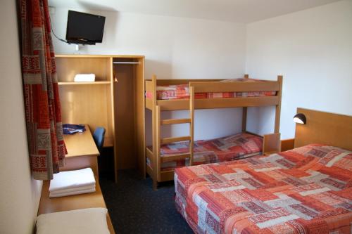 Postel nebo postele na pokoji v ubytování Quick Palace Vannes