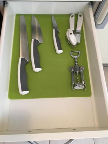 a knife and other kitchen utensils in a drawer at Boardinghouse Casita Amann in Friedrichshafen