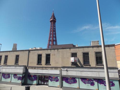 an old building with a tower in the background at Topaz Blackpool in Blackpool