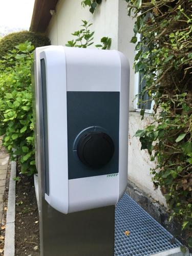 a white and black speaker on the side of a building at Hotel Beausite in Interlaken