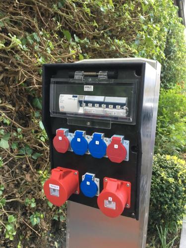 an atm machine with red and blue dials at Hotel Beausite in Interlaken