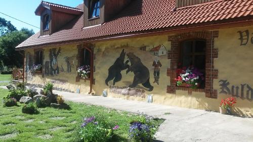 a painting of a horse on the side of a house at Kuldkaru Manor in Valaste