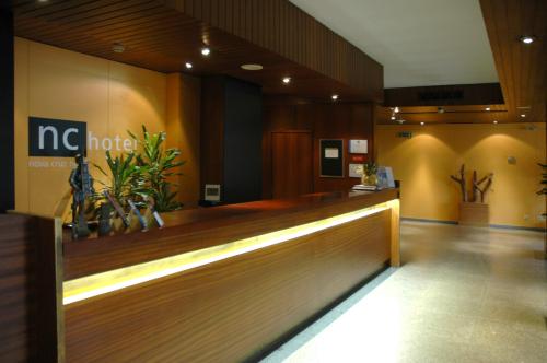 a lobby of a hospital with a reception desk at Nova Cruz Hotel in Santa Maria Da Feira