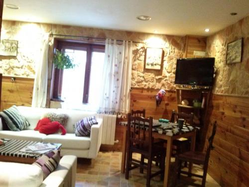 a living room with a couch and a table at Casa Marieta in Canfranc-Estación