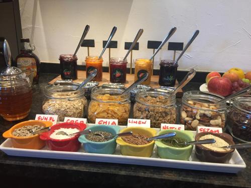 a tray filled with jars of food on a table at Villa 7 in Flachau