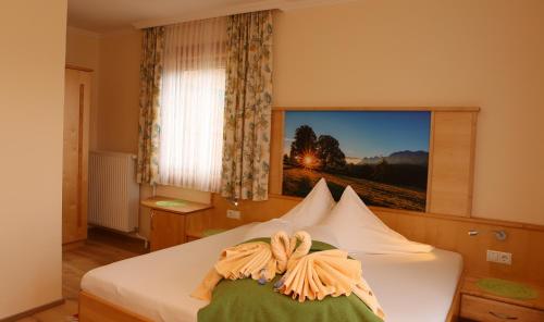 Postel nebo postele na pokoji v ubytování Aparthotel Ramsau