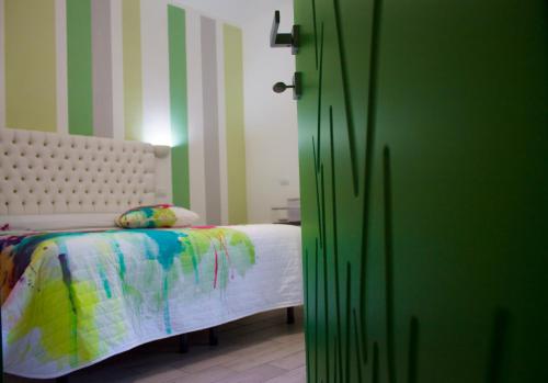 Giường trong phòng chung tại B&B L'Arcobaleno