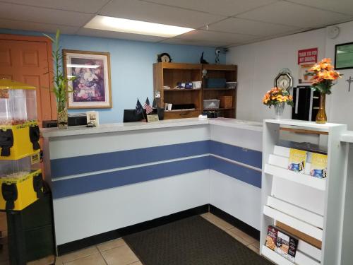 a blue and white counter in a store at Rodeway Inn in La Crosse