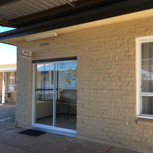 an entrance to a building with a sliding glass door at Motel Yarrawonga in Yarrawonga