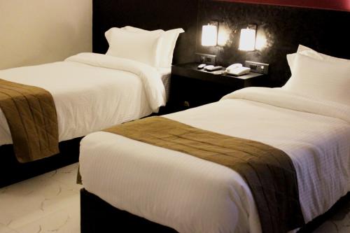 Hotel Grand Tizuにあるベッド