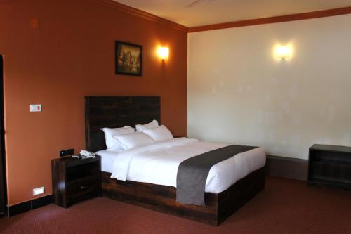 Lova arba lovos apgyvendinimo įstaigoje Hotel Grand Tizu