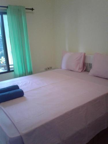 Кровать или кровати в номере Melbao Homestay
