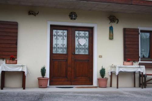 a front door of a house with plants in front at Albergo Diffuso Faller in Faller
