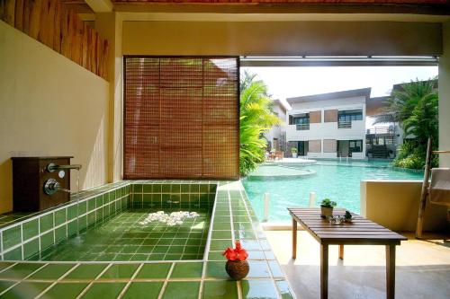 a view of a swimming pool from a house at The Hideaway Resort in Hua Hin