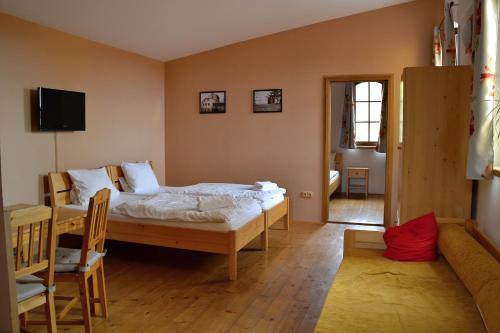 Katil atau katil-katil dalam bilik di Penzion Mlýn Sedlec