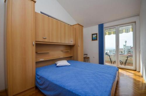 Postel nebo postele na pokoji v ubytování Apartmani Meri