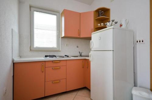 Kuchyň nebo kuchyňský kout v ubytování Apartmani Meri