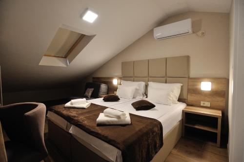 מיטה או מיטות בחדר ב-Villa Divani