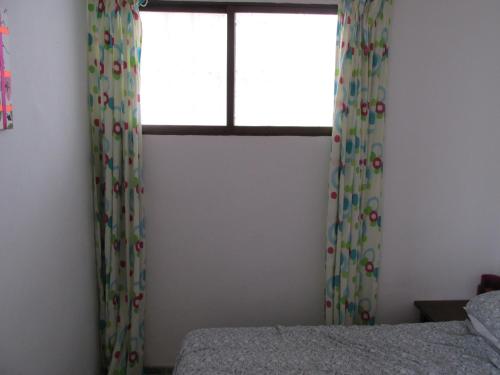 Llit o llits en una habitació de Chalana Apartment
