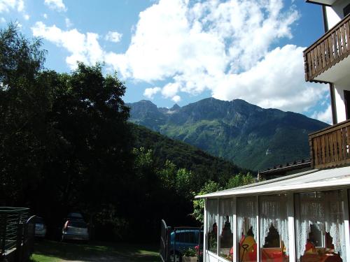 a house with a view of a mountain at Hotel alle Rose in Cavedago