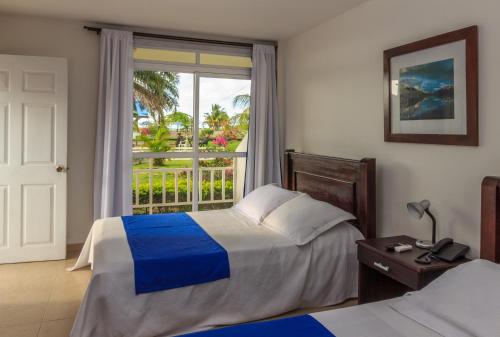 Katil atau katil-katil dalam bilik di Hotel & Resort Villa del Sol