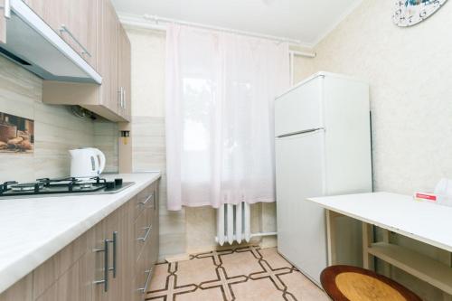 Кухня или мини-кухня в Cosy central Apartment

