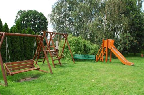 a group of playground equipment in a park at Hotel U Witaszka in Czosnów