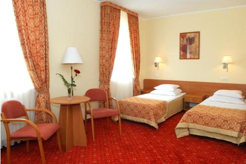 Postel nebo postele na pokoji v ubytování Hotel U Witaszka