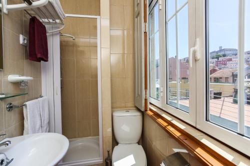 Kylpyhuone majoituspaikassa Residencial Aviz