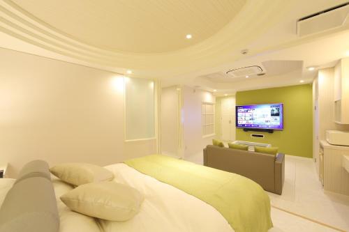 Кровать или кровати в номере Hotel Water Gate Hamamatsu (Adult Only)