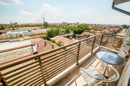 a balcony with a view of a city at C Guest House in Drobeta-Turnu Severin