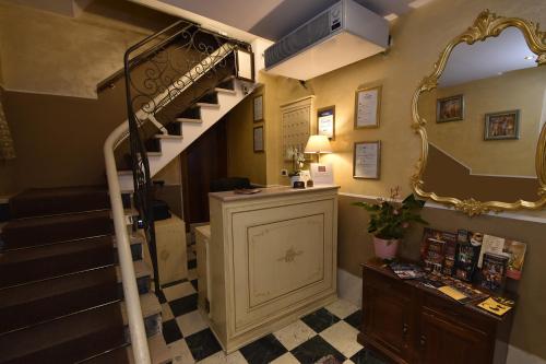 a room with a staircase and a mirror at Locanda Poste Vecie in Venice
