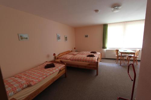 Cama o camas de una habitación en Landhotel Gutsherrn-Klause