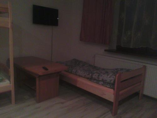 A television and/or entertainment centre at Hostel Sosnowiec