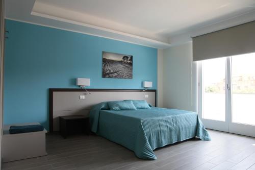 Ένα ή περισσότερα κρεβάτια σε δωμάτιο στο Sud Est Guest House